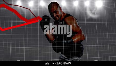 Multiple red graphs moving over grid networking against african american male boxer Stock Photo