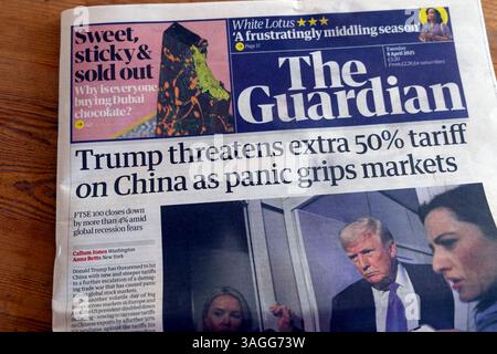 Donald 'Trump threatens extra 50% tariff on China as panic grips markets' Guardian newspaper headline US government tariffs article 8 April 2025 London UK Stock Photo
