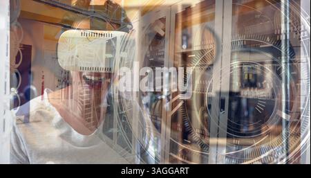 Hands interacting with futuristic digital interface over server room Stock Photo
