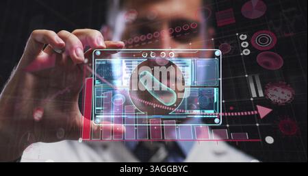 Covid-19 statistical data processing against caucasian male doctor holding futuristic screen Stock Photo
