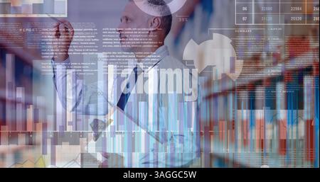 Financial and statistical data processing against male supervisor checking stock in warehouse Stock Photo