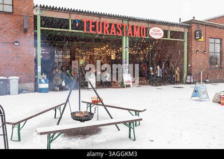 Snowfall at Teurastamo Christmas Market in Helsinki, Finland Stock Photo