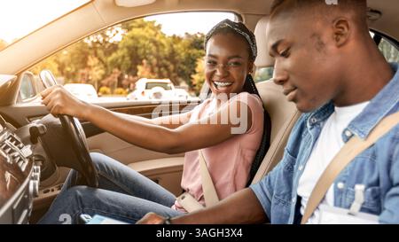 Black man instructor examinating happy lady student Stock Photo