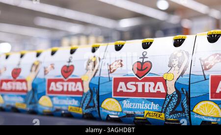 A vibrant display of Astra beer packs showcasing its playful design and branding, ideal for casual gatherings. - FRANKFURT, GERMANY - MARCH 21, 2025 Stock Photo