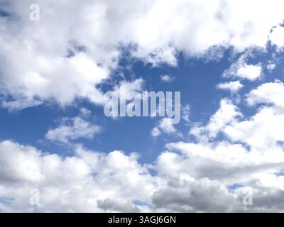 White clouds stratocumulus on overcast sky frame in the centre blue sky, international Stock Photo