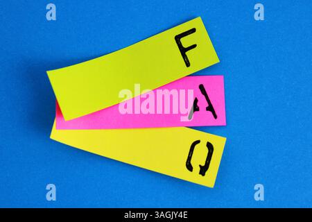 FAQ, sticky notes with frequently asked questions and question marks ...