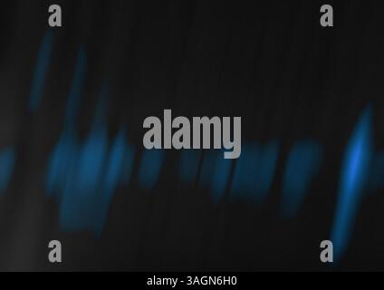 Abstract smudges and streaks on a dark blue black background. Abstract gradient with grainy texture. Flashes of blue light in the dark. Cinematic pic. Stock Photo