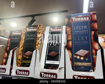 Kyiv, Ukraine - April 08, 2025: Selection of Torras chocolate bars featuring various flavors and ingredients on a store shelf Stock Photo