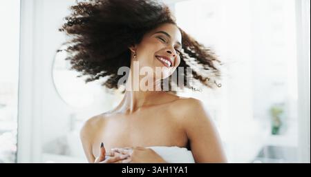Happy woman, laughing or afro hair care in bathroom with confidence for grooming, growth or volume. Shampoo, fun or playful African person with beauty Stock Photo