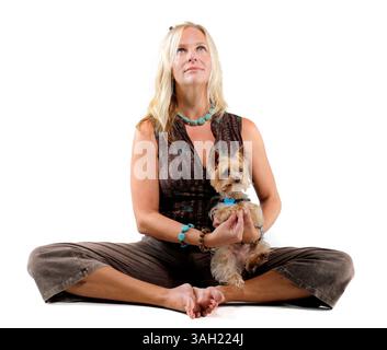 SP 308805 FOUN PBYOGA 3 (07/09/2009 St. Petersburg) Wendy Hessinger, of St. Petersburg, sits in a cobbler's pose with her  three-year-old Yorkshire terrier Gizmo on July 9, 2009 in the St. Petersburg Times studio. (Credit Image: © St. Petersburg Times/ZUMA Press) Stock Photo