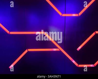 Neon Red Zigzag on Blue Metal Texture Motion at Eye Level Stock Photo