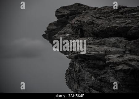 Close-Up of Dark Layered Rock Formation Stock Photo