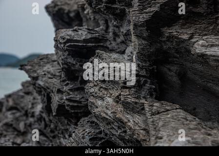 Close-Up of Dark Layered Rock Formation Stock Photo