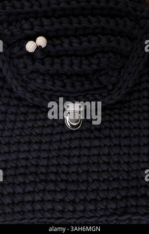Black crochet backpack or bag full frame crop   background Stock Photo