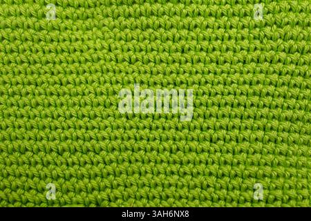 Hand made crochet pattern, textured mint green abstract background, with horizontal lines Stock Photo