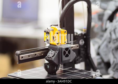 Modern 3D printer printing plastic product. Industry Stock Photo