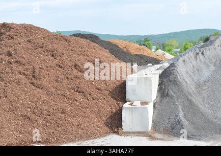 A veritable mountain of mulch, gravel, top soil and sand on a nice warm, clear day. Stock Photo