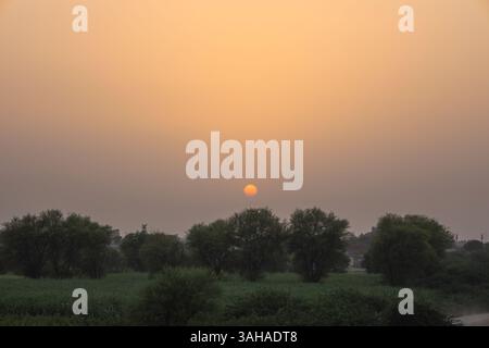 Beautiful sunset over the agricultural region of Punjab, Pakistan Stock Photo