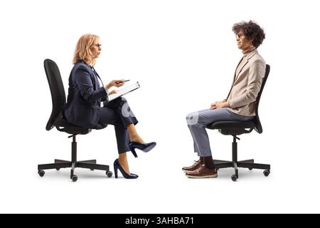 Man and woman sitting in office chairs, job interview concept isolated on white background Stock Photo