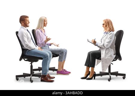 Couple sitting and having a conversation with a doctor isolated on white background Stock Photo
