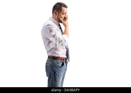 Worried professional man standing and thinking isolated on white background Stock Photo