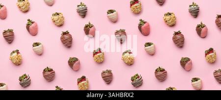 Many tasty strawberries dipped in chocolate on pink background. Pattern for design Stock Photo