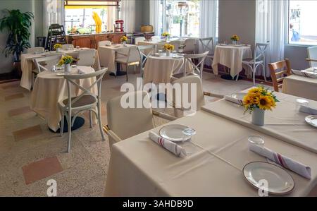 Empty restaurant with white tablecloths Stock Photo