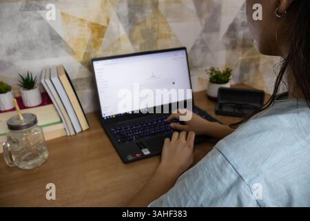Chat GPT help generate ideas and create content on screen with AI chat and female hands typing Stock Photo