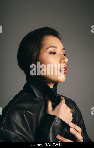 A stunning woman showcases her beauty and poise in an artistic display ...