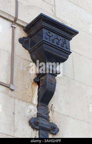 Water collection and metal gutter pipe in Westminster, London. Architectural details found on the streets of central London. Iron drainpipe from 1900 Stock Photo