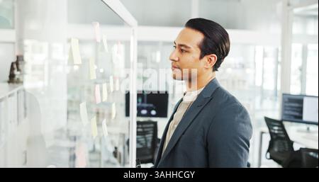 Reading, glass and man with ideas, serious and info for strategy in corporate company and plan. Office, banker and person with sticky notes for Stock Photo