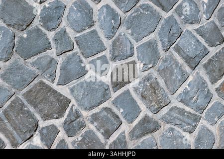 wall of grey natural stones as background Stock Photo