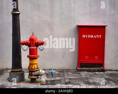Fire extinguishers used as an environmental protection system installed at the roadside Stock Photo