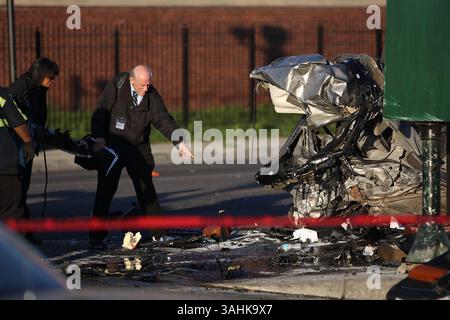 June 26, 2017 - Chicago, IL, USA - Chicago police officers investigate the scene of a double fatal car crash that involved an off-duty police officer at the intersection of South Kostner Avenue and West Roosevelt Road on Tuesday, June 27, 2017, in Chicago's North Lawndale neighborhood. (Credit Image: © Alyssa Pointer/TNS via ZUMA Wire) Stock Photo