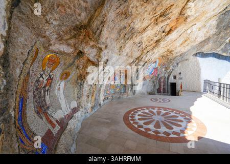 Mosaics on the rock face of the cliff where the upper Ostrog Monastery of the Serbian Orthodox Church was built - This is the most popular pilgrimage Stock Photo