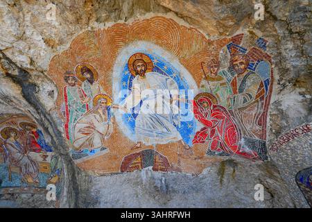 Mosaics on the rock face of the cliff where the upper Ostrog Monastery of the Serbian Orthodox Church was built - This is the most popular pilgrimage Stock Photo