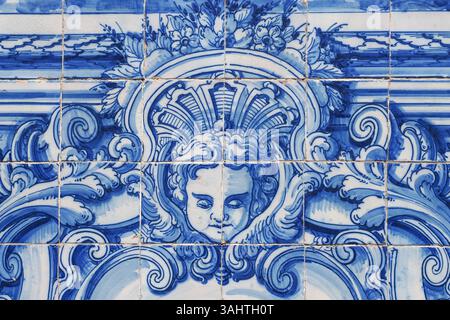 Fragment of exterior facade. Chapel of Souls. Church is covered with blue and white azulejo tiles, with scenes from the lives of saints and angels. Stock Photo