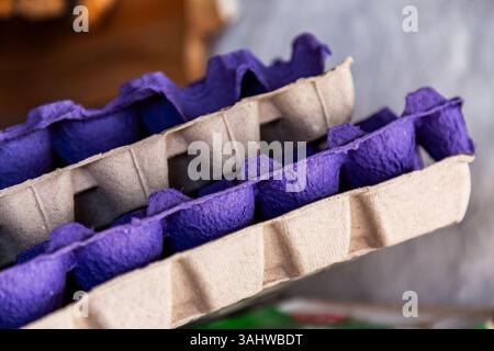 Stack of used egg trays, recycled paper containers Stock Photo