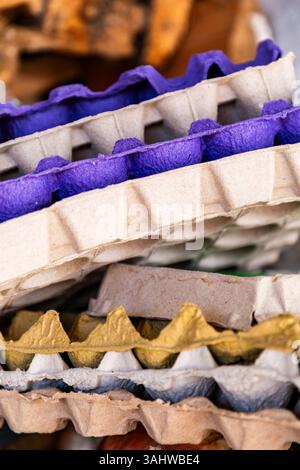 Stack of used egg trays, recycled paper containers Stock Photo