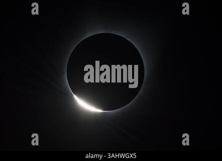 August 21, 2017 - Madras, Oregon - The Diamond Ring  effect is seen as the moon makes its final move over the sun during the total solar eclipse on Monday, August 21, 2017 above Madras, Oregon. A total solar eclipse swept across a narrow portion of the contiguous United States from Lincoln Beach, Oregon to Charleston, South Carolina. A partial solar eclipse was visible across the entire North American continent along with parts of South America, Africa, and Europe.  .Mandatory Credit: Aubrey Gemignani / NASA via CNP (Credit Image: © Aubrey Gemignani/CNP via ZUMA Wire) Stock Photo