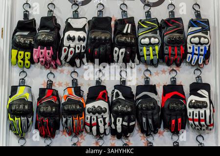 motorcycle gloves in the store. gloves for a person riding a scooter Stock Photo