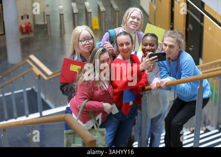 Disabled students taking selfie at university Stock Photo