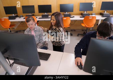 Teacher and students with disabilities at university Stock Photo