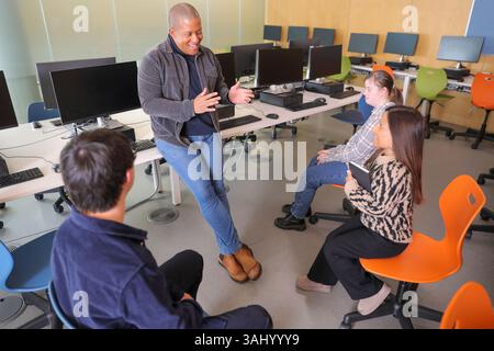 Teacher and students with disabilities at university Stock Photo