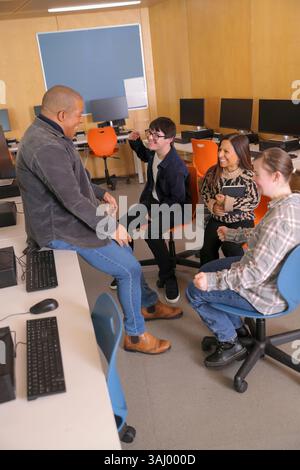 Teacher and students with disabilities at university Stock Photo