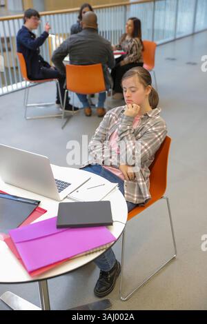 Student with Down syndrome at university Stock Photo