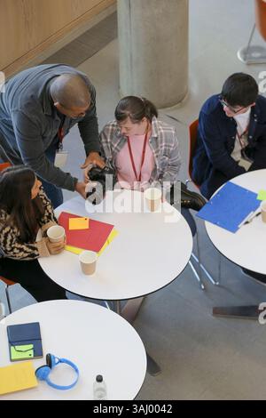 Disabled students and teacher at university Stock Photo