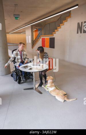 Disabled coworkers in office Stock Photo