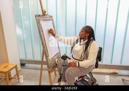 Disabled woman drawing at art classes Stock Photo