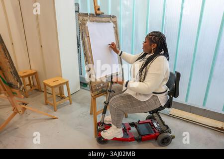 Disabled woman drawing at art classes Stock Photo